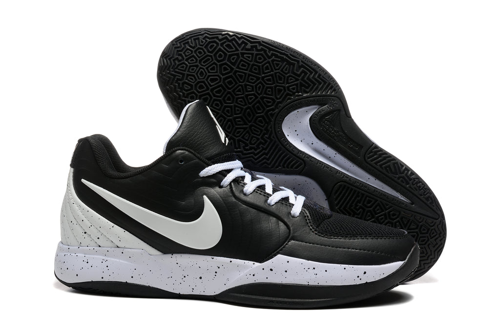 Black and white Nike Ja 2 basketball shoes with a speckled midsole, side and outsole views