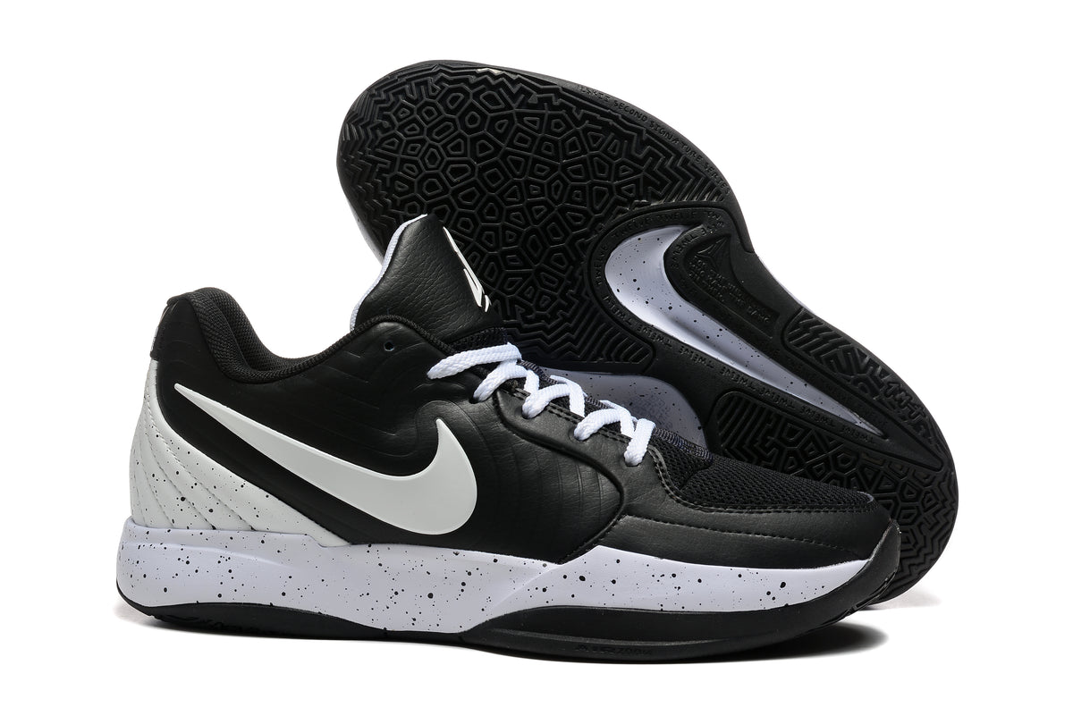 Black and white Nike Ja 2 basketball shoes with a speckled midsole, side and outsole views
