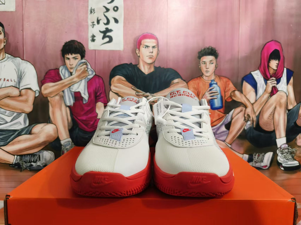 Front view of white and red Nike basketball shoes with lace-up closure