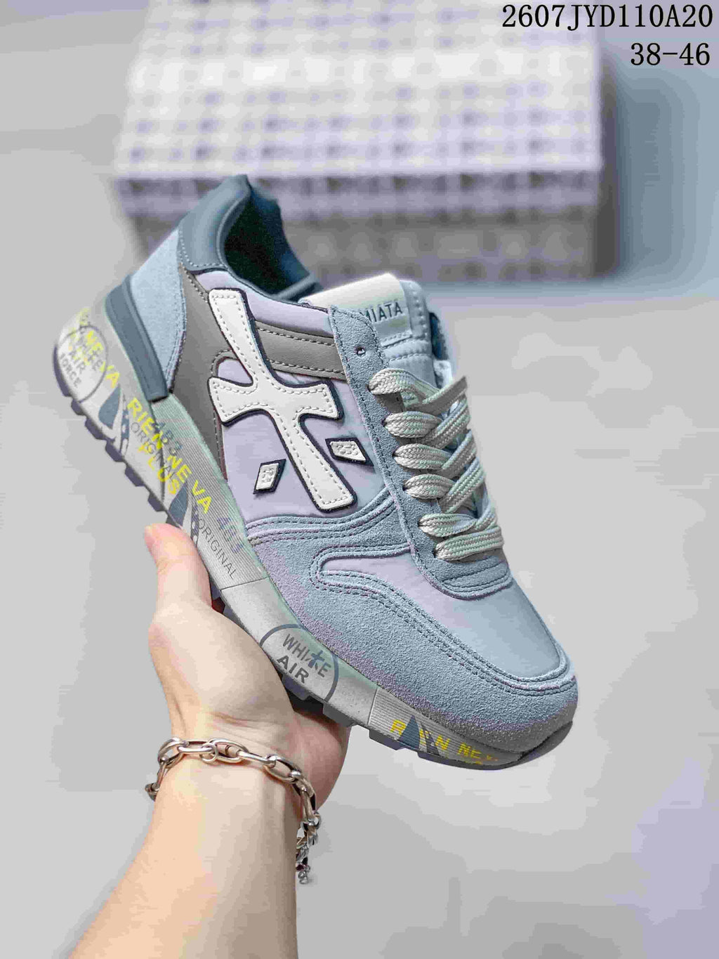 Light gray and lilac Premiata sneaker with white side detail and layered panels.