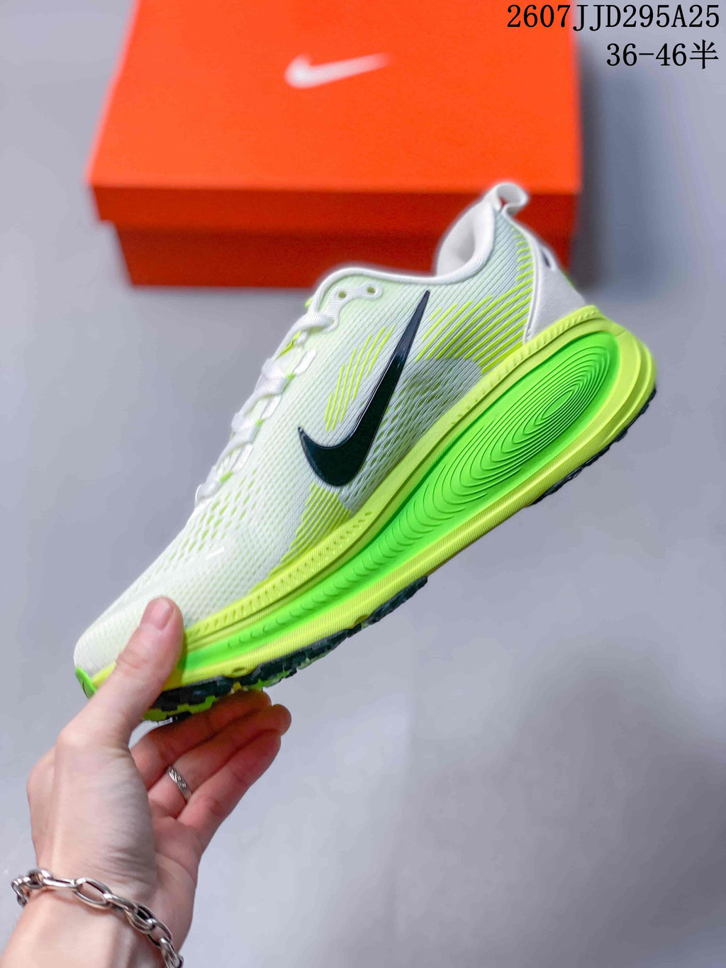 Side profile showing the white patterned upper, black Swoosh, neon green midsole and black outsole.