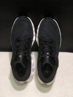 Top view of the pair showing black uppers, black laces, and padded tongues.