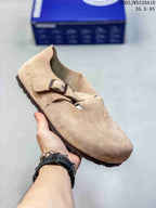 Light tan closed-toe sandal with two buckle straps; size range text appears in the image.