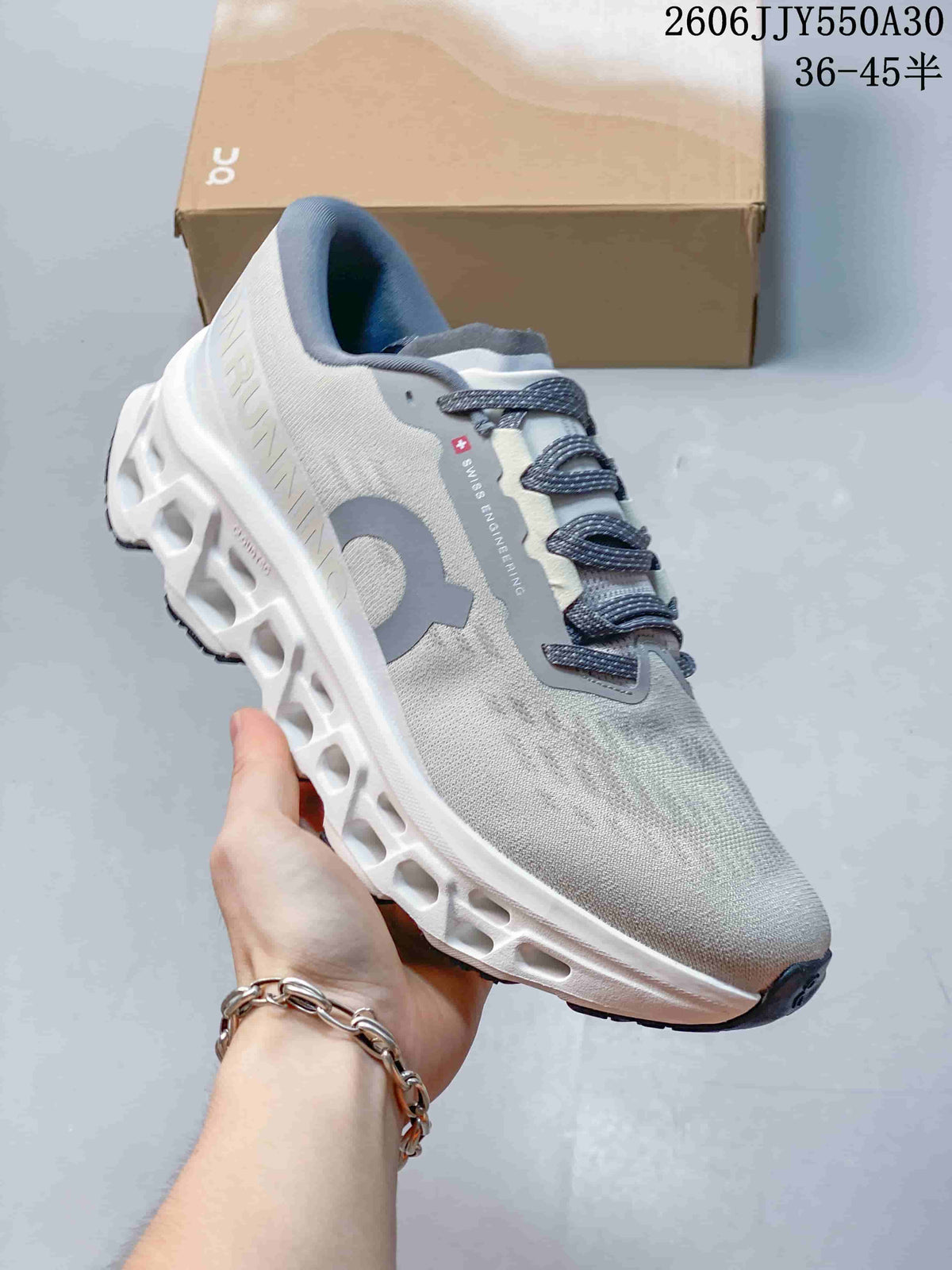 Angled side view of the running shoe with dark laces and sculpted sole