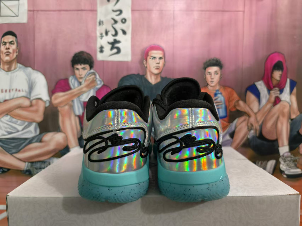 Rear view of silver holographic basketball shoes with turquoise speckled outsoles and black heel details