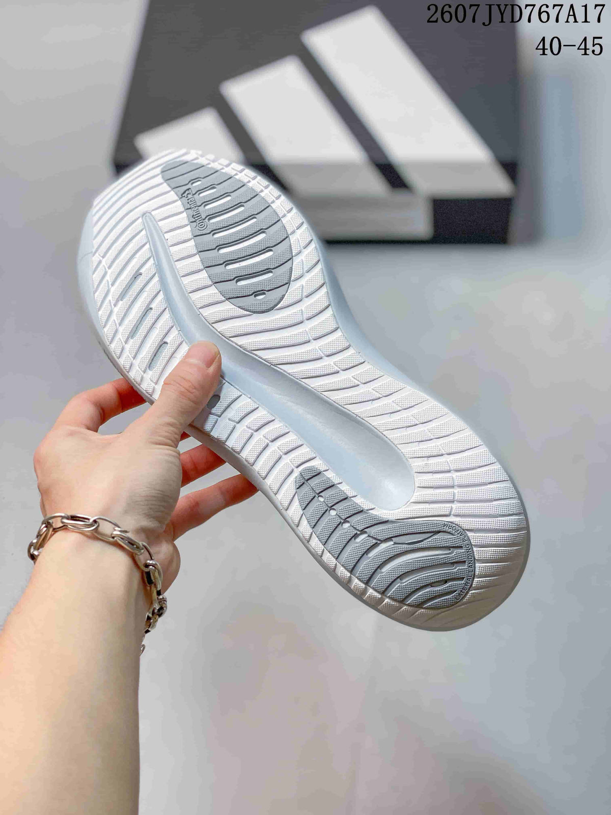 Close-up of the sneaker outsole showing a white patterned tread with grey traction sections.