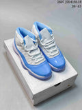 Pair of blue and white Jordan Air Jordan 11 Retro high-top sneakers displayed on a shoebox.
