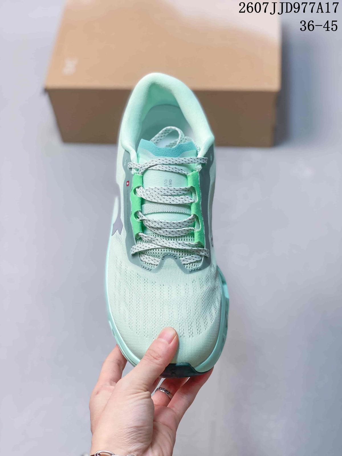 Top view of the mint green sneaker showing the rounded toe, gray laces, and bright green lace-panel details.