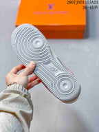 Close view of the textured light-grey rubber outsole with concentric circular tread patterns.