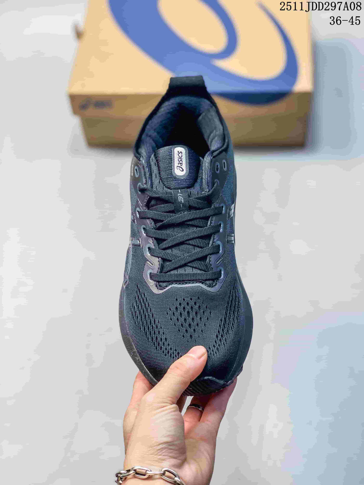 Top view of the dark gray lace-up sneaker showing the ASICS tongue label, eyelets, laces, and textured forefoot.