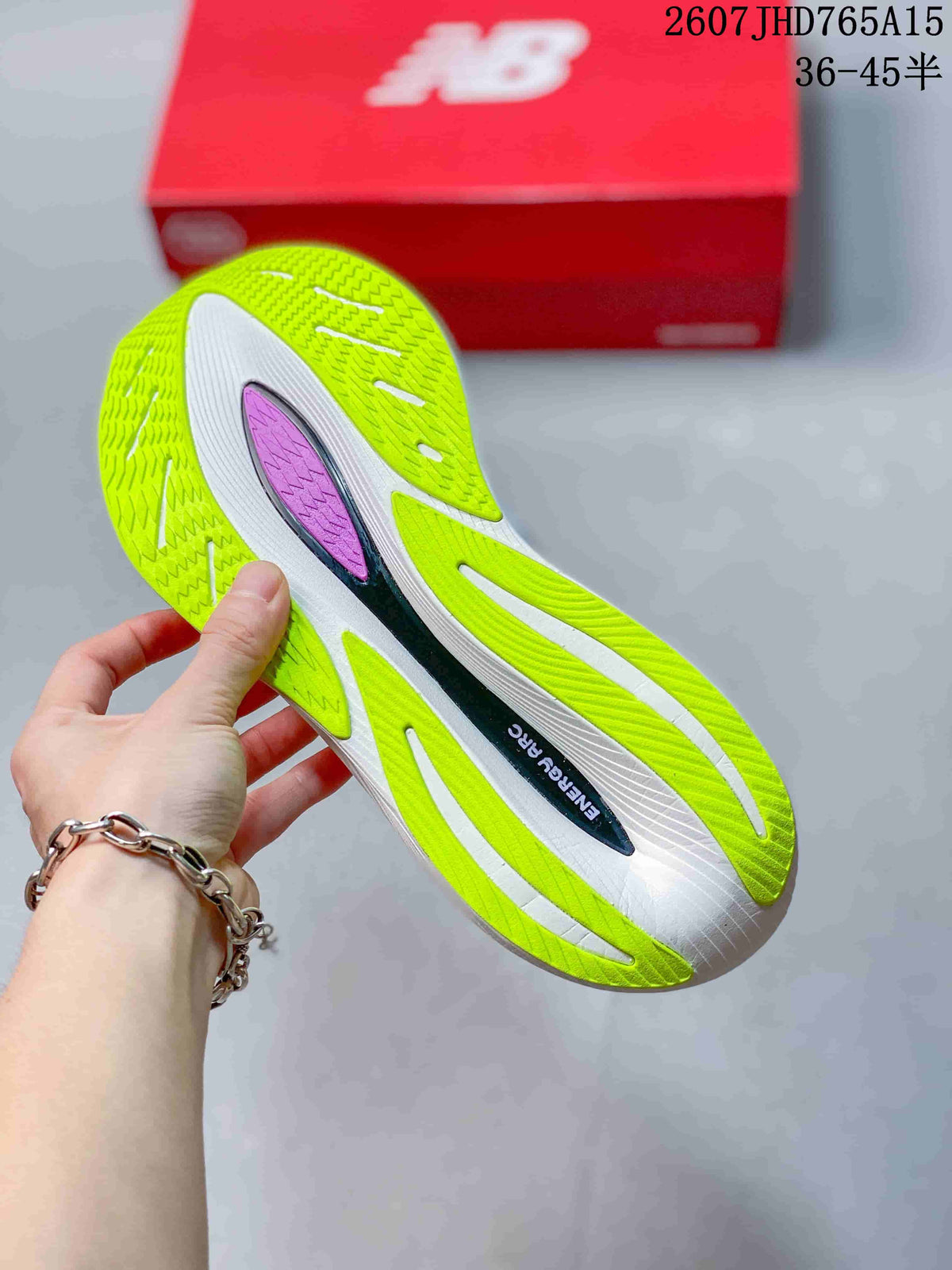 Bottom view of the running shoe showing the lime-colored outsole, white sections, and central insert.