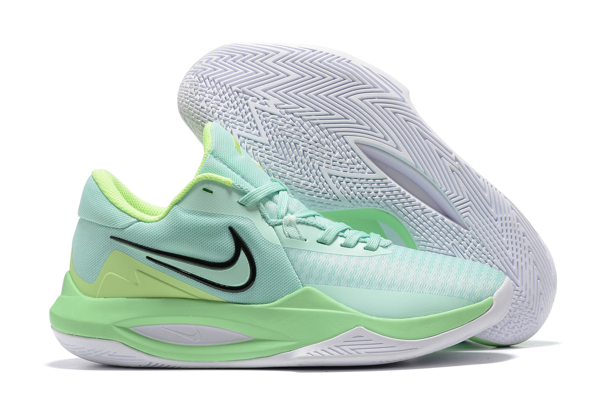 Mint and lime green basketball shoe with black accents and a white outsole.