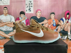 Side view of a brown Nike low-top sneaker with a white Swoosh and sculpted two-tone sole.