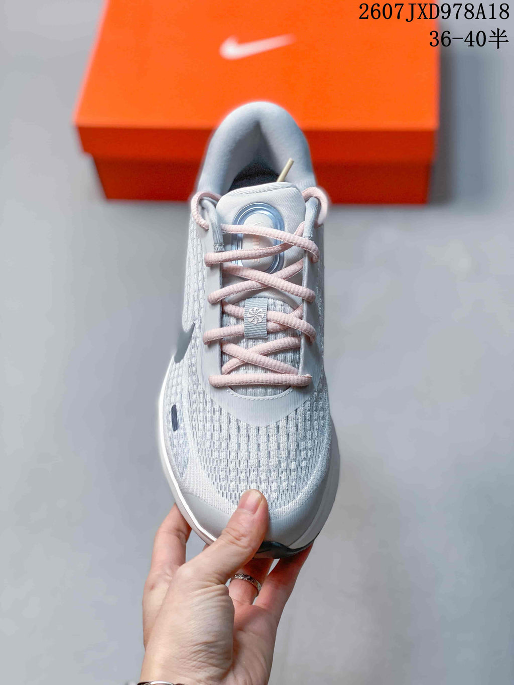 Top view of the Nike Journey Run shoe showing the textile mesh toe box, pink laces and padded tongue.