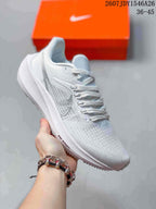 Light gray and white Nike Air Zoom Pegasus 39 sneaker shown from a front-side angle.