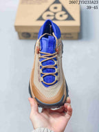 Top view showing the tan laces, blue tongue, textured upper, and structured toe area.