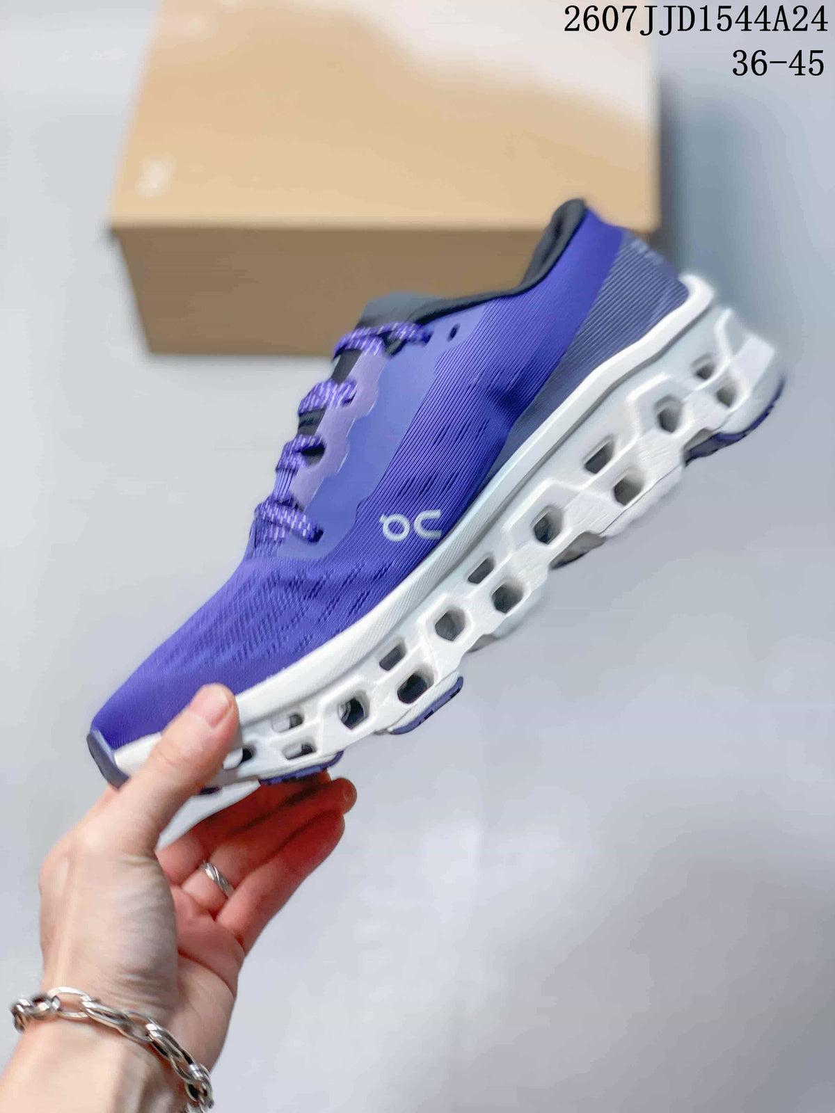 Side view of the purple running shoe showing the On logo, textured upper, and sculpted white midsole.