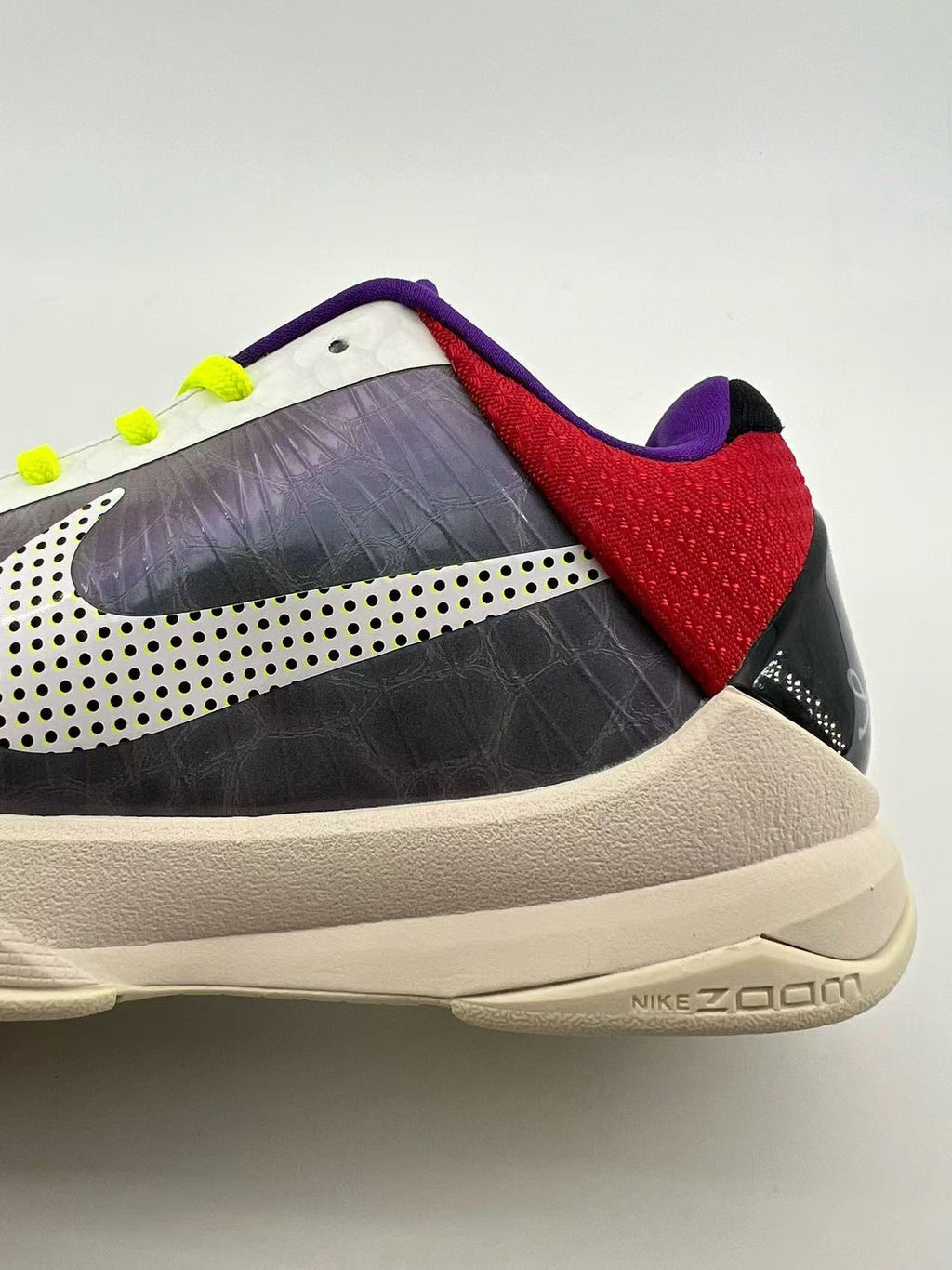 Close-up of the heel and side panel with a dotted logo