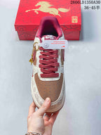 Top view showing red laces, brown perforated toe, and patterned cream panels