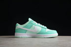 Side profile of the sneaker showing the mint green panels, white Swoosh, white midsole, and mint outsole.