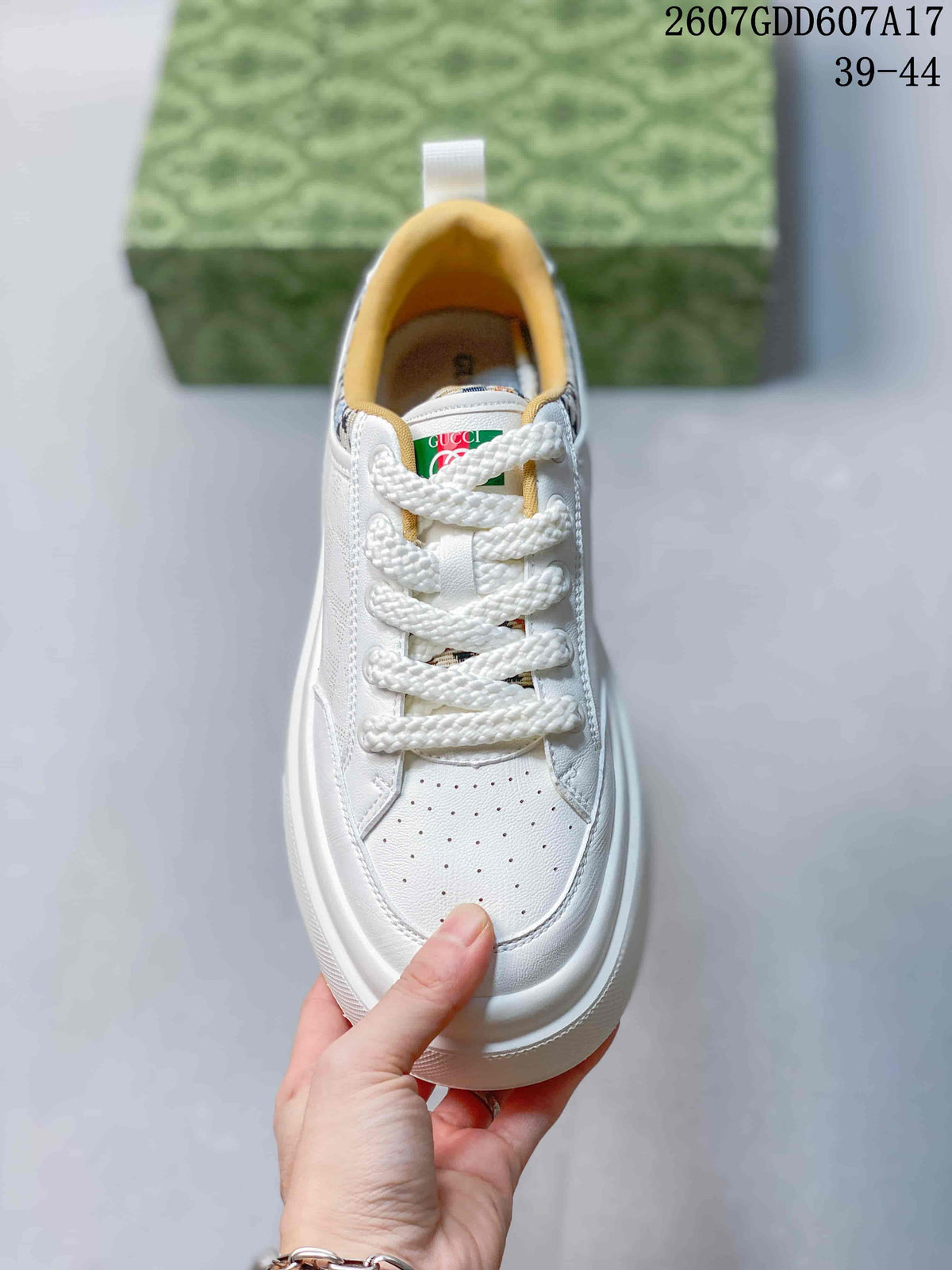 Top view showing the white laces, perforated toe panel and tongue branding.