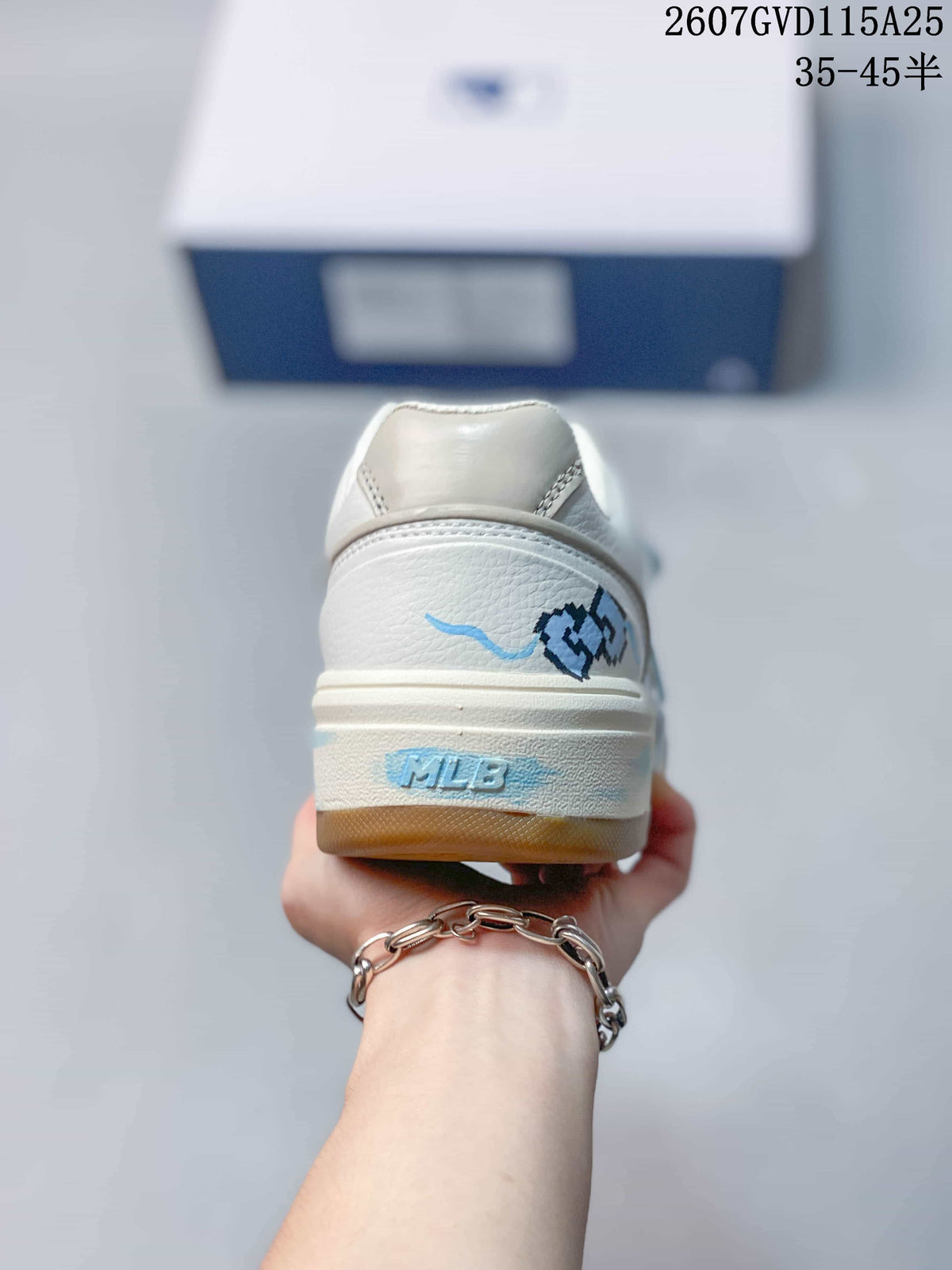 Rear view of the sneaker showing the padded heel area, blue graphics, and MLB branding on the sole.