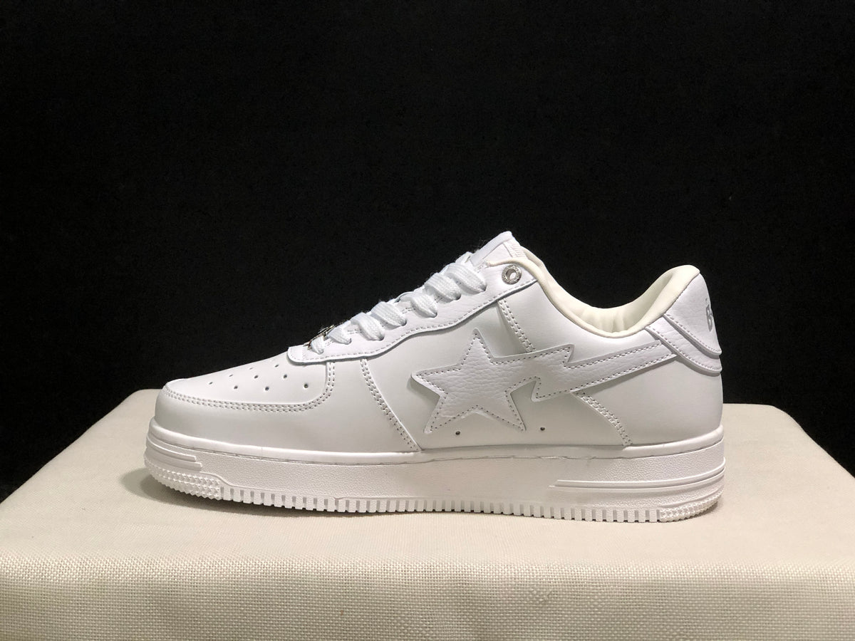 Side profile showing the tonal star panel, low-top construction, padded collar, and textured outsole.
