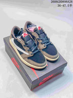 Pair of navy and taupe low-top sneakers on a branded shoebox
