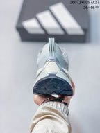 Rear view showing the padded heel, pull tab, adidas logo, and dark outsole edge.