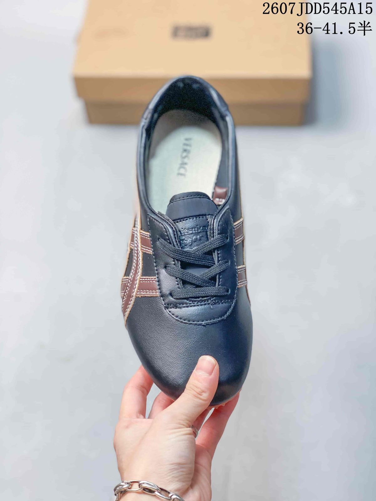 Top view showing the rounded toe, dark laces, layered side stripes, and branded insole.