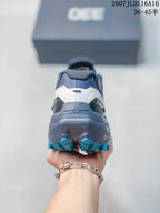 Rear view of the KAILAS FUGA EX330 shoe showing the structured heel and blue outsole lugs.