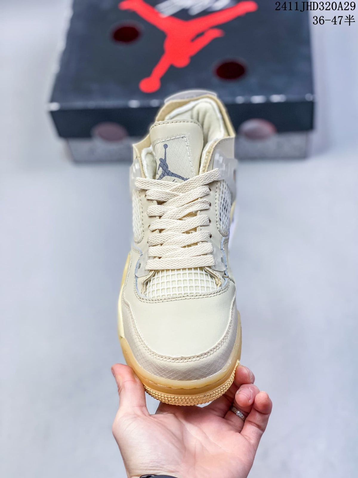 Front view showing the cream upper, woven tongue label, laces, and mesh toe panel