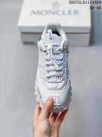 Top view of the white sneaker showing the lace-up construction, padded tongue and layered toe area.