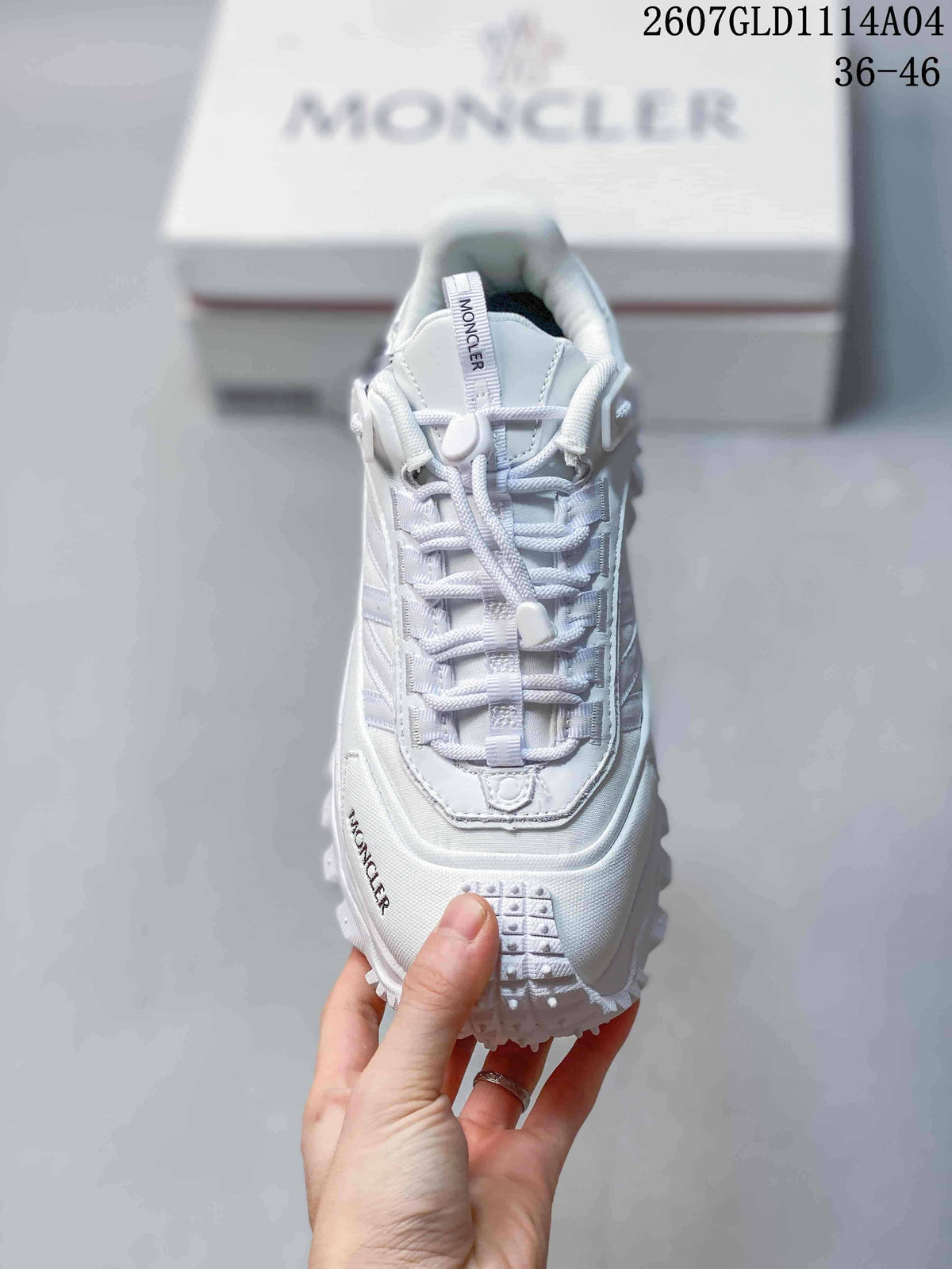 Top view of the white sneaker showing the lace-up construction, padded tongue and layered toe area.