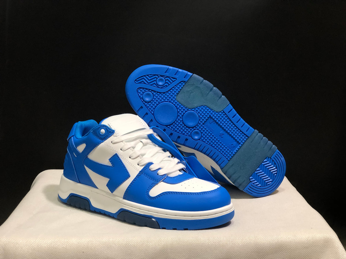 Angled view showing one sneaker's blue rubber outsole and the other sneaker's side profile.