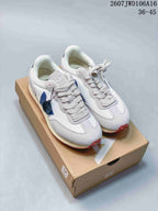 Pair of white and blue VEJA sneakers displayed on a branded box, with the style code and EU size range visible above.