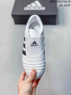 Top view of the sneaker showing the broad stitched tongue panel, adidas logo and padded collar.