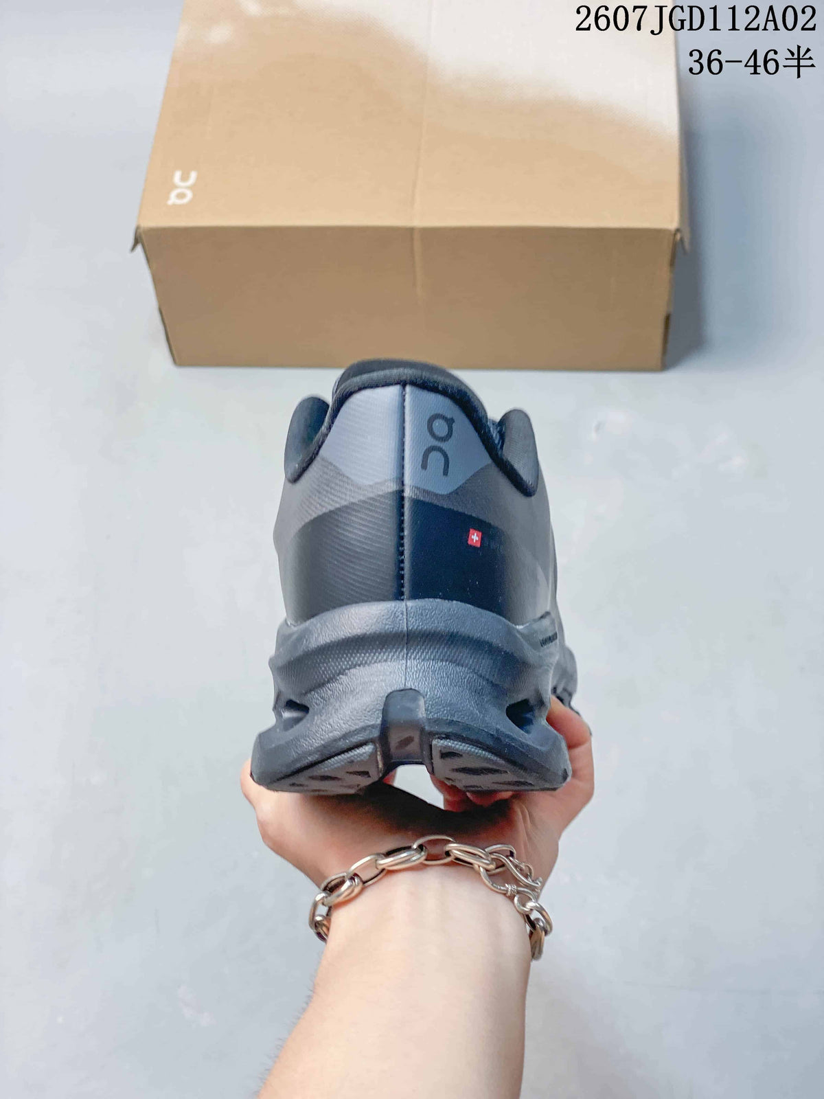 Rear view of the gray sneaker showing the heel and sole design.