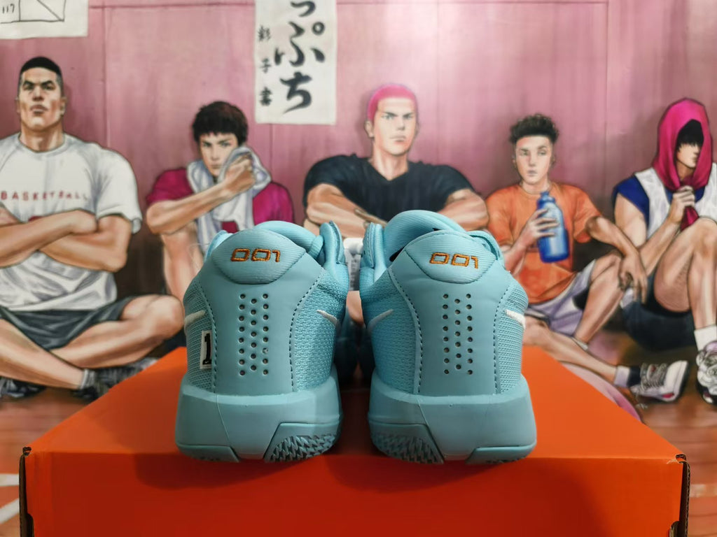 Rear view of blue Nike basketball shoes showing perforated heel panels and heel markings.