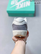 Rear view of the Nike SB Force 58 sneaker showing the grey heel panel, white collar and embossed Nike SB branding.