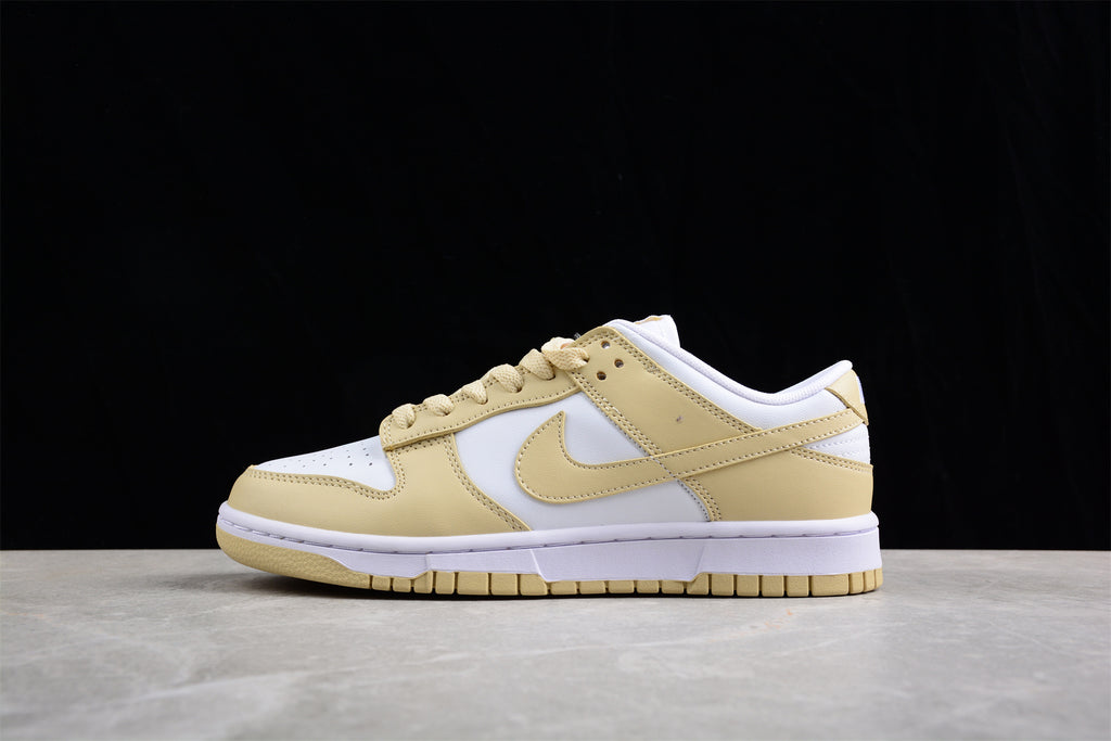 Opposite side profile showing the low-top silhouette, cream overlays, white panels, and rubber outsole.