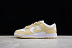 Opposite side profile showing the low-top silhouette, cream overlays, white panels, and rubber outsole.