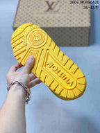 Close-up of the yellow sneaker outsole showing a patterned rubber tread and central Louis Vuitton branding.