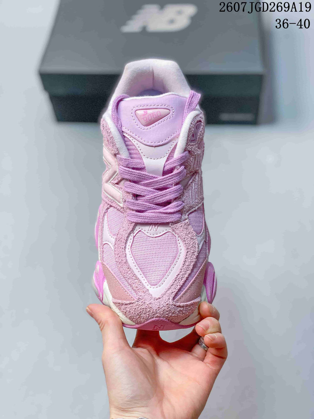 Front view showing the 9060 tongue marking, layered toe panels, laces, and mesh detailing.