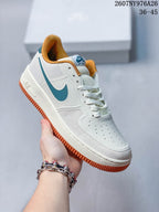 White Nike Air Force 1 '07 LV8 sneaker with teal Swoosh, mustard collar and gum-colored outsole.