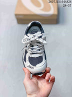 Top view of an ASICS HYPERSYNC kids’ sneaker showing the laces, tongue and contrasting toe panels.
