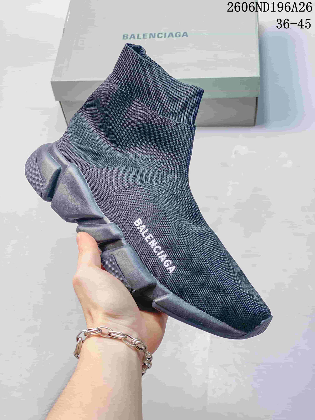 Dark knit sock-style sneaker with a charcoal segmented sole.
