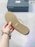 Underside of the sneaker showing its repeating textured rubber outsole pattern and branded outsole detail.