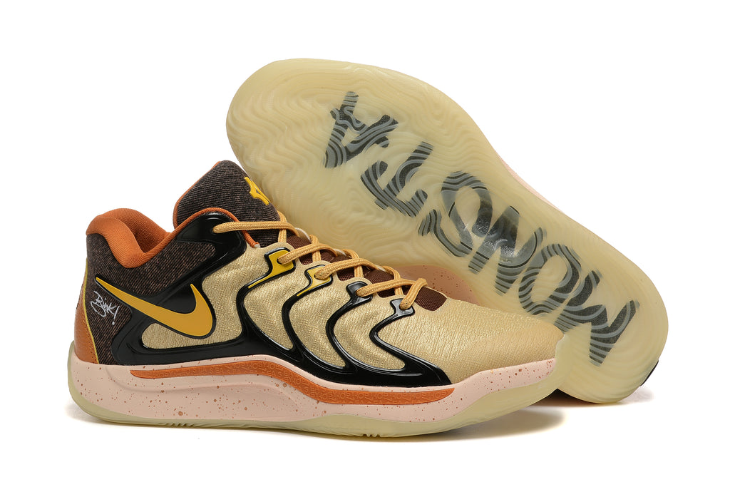 Brown and black Nike KD 17 basketball shoes with gold accents and a translucent outsole.