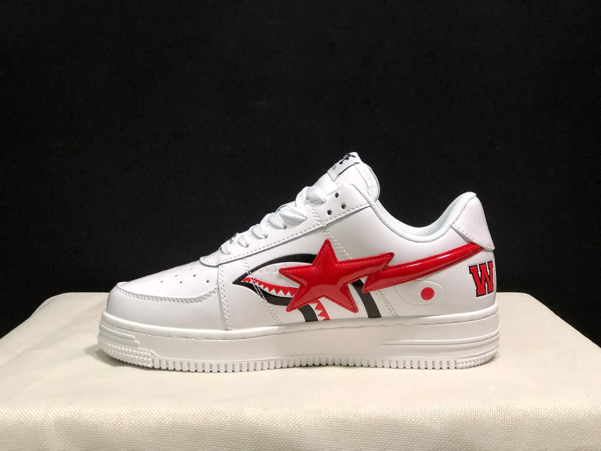 Side profile showing the white low-top silhouette, red star and shark-inspired side graphic, and heel lettering.